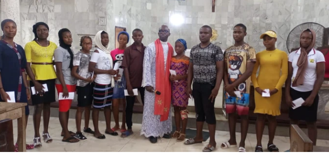 Catholic Priest pays WAEC, NECO fees for 12 Indigent students in Anambra